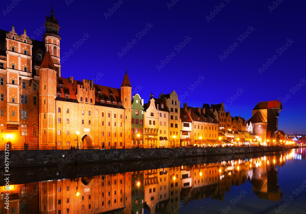 Night view of lighted Motlawa embankment in Polish city of Gdansk .