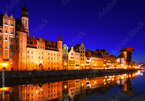 Night view of lighted Motlawa embankment in Polish city of Gdansk .