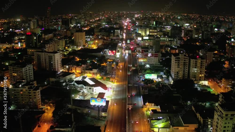 Traffic on February 27 avenue on an illuminated night, vehicles transiting, shot with drone