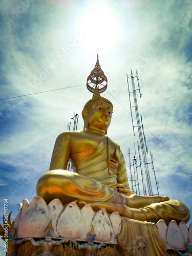 The Buddha statue in the sky and clouds background