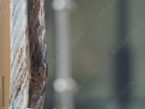 A magnified detail of the wire rope that rusted on the surface of the metal beautifully