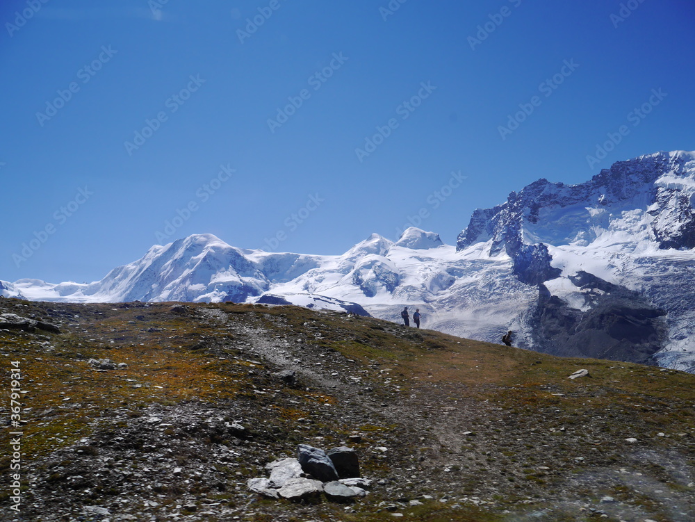 A picture of a tourist trail touring the beautiful nature trekking route of Matterhorn mountain nature tour in Switzerland, August 15, 2015.