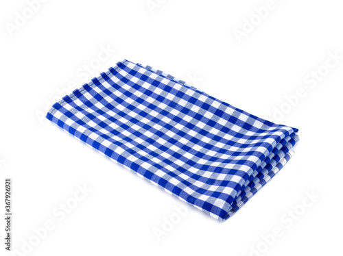 Closeup of blue and white checkered fabric or napkin isolated on white background. Concept kitchen utensils and tableware..