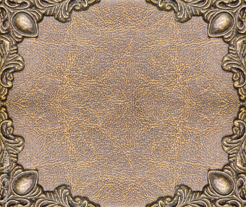 metal frame design on brown and yellow leather background