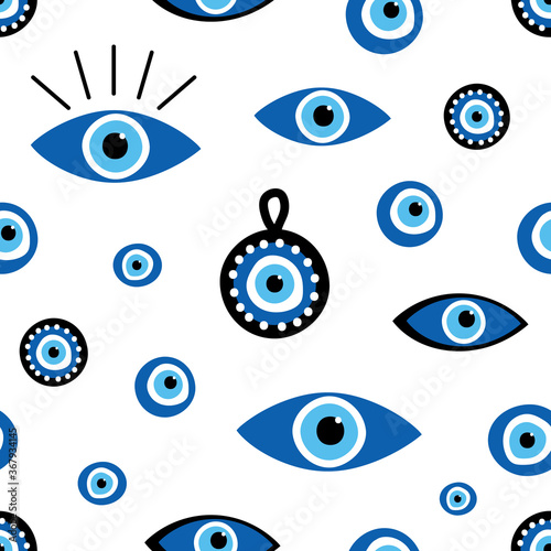 Vector seamless pattern background with variety of turkish blue eye-shaped amulets, nazar talismans. photo