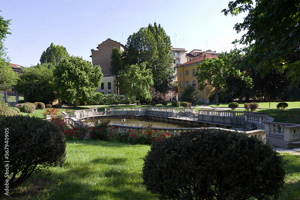 Milan - Guastalla Garden historic garden, the baroque fishpond enclosed by an elegant granite balustrade. Lombardy
