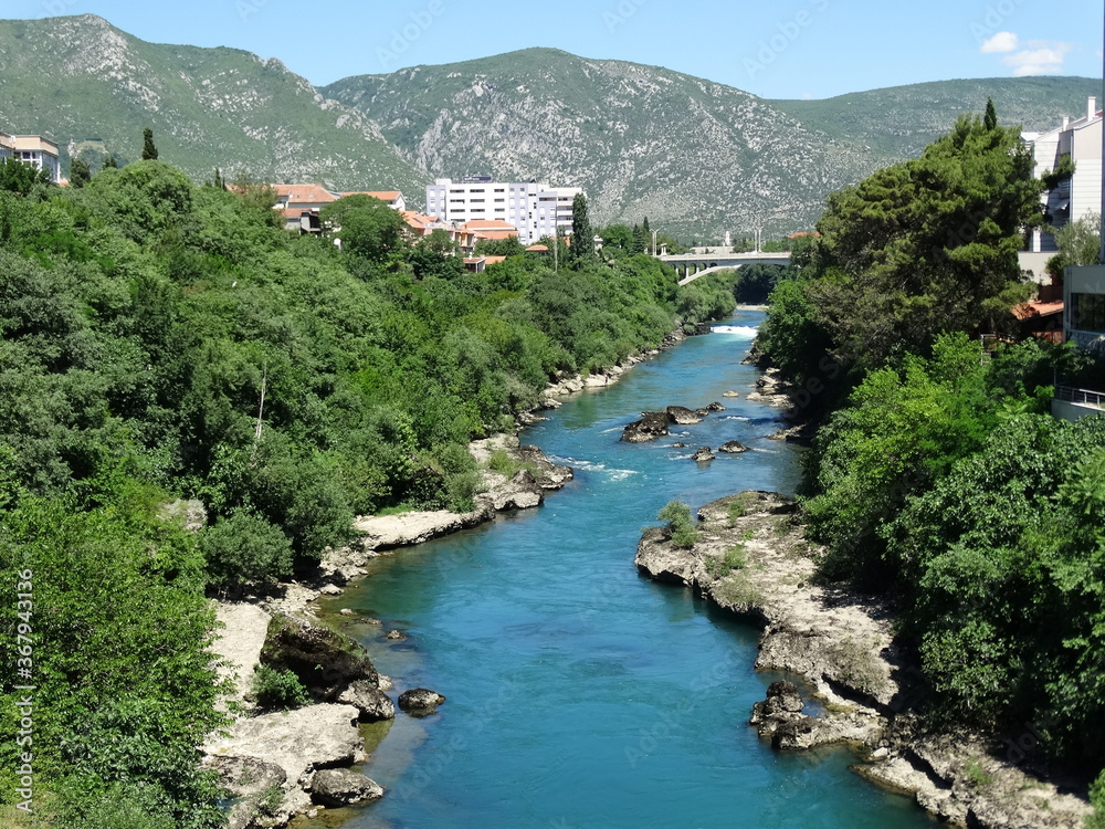 A bridge in Mostar old city cross over Neretva river. Mostar is a city and the administrative center of Herzegovina Neretva Canton of the Federation of Bosnia and Herzegovina.