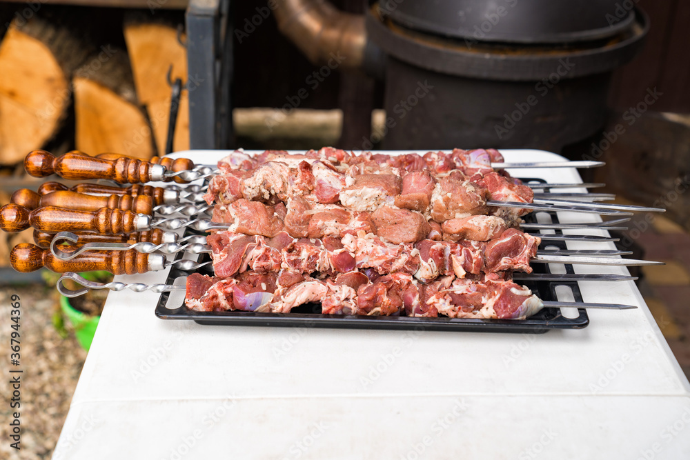 raw meat on skewers for cooking kebabs on grill.