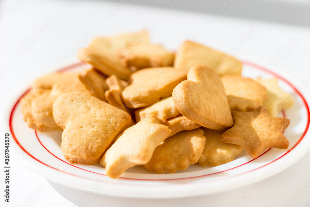 Homemade butter cookies on a dish in beautiful sunlight Homemade butter cookies on a dish in beautiful sunlight