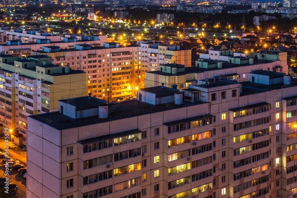 View from above of the roofs of contemporary block of flats. Ulyanovsk residential district at night, Russia.