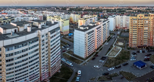 View from the roof of Ulyanovsk residential district in the evening. Blocks of flats  streets and cars parkings. Russia.