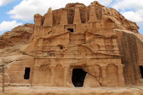 Obelisk tomb in ancient Petra city in Jordan. The building is carved out of sandstone right into the rock. Theme of travel in Jordan.