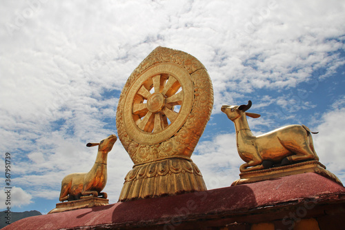 Gilded deers with dharmacakra on the top of the roof at Jokhang Temple in Lhasa, Tibet, China
