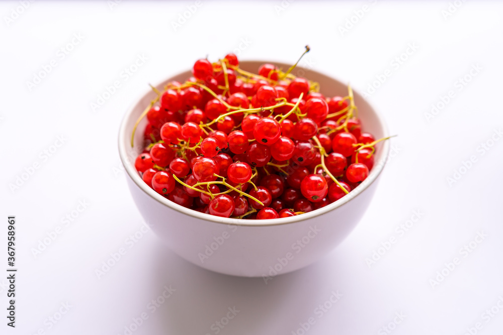 Fresh berries red currants in a white plate Fresh berries red currants in a white plate