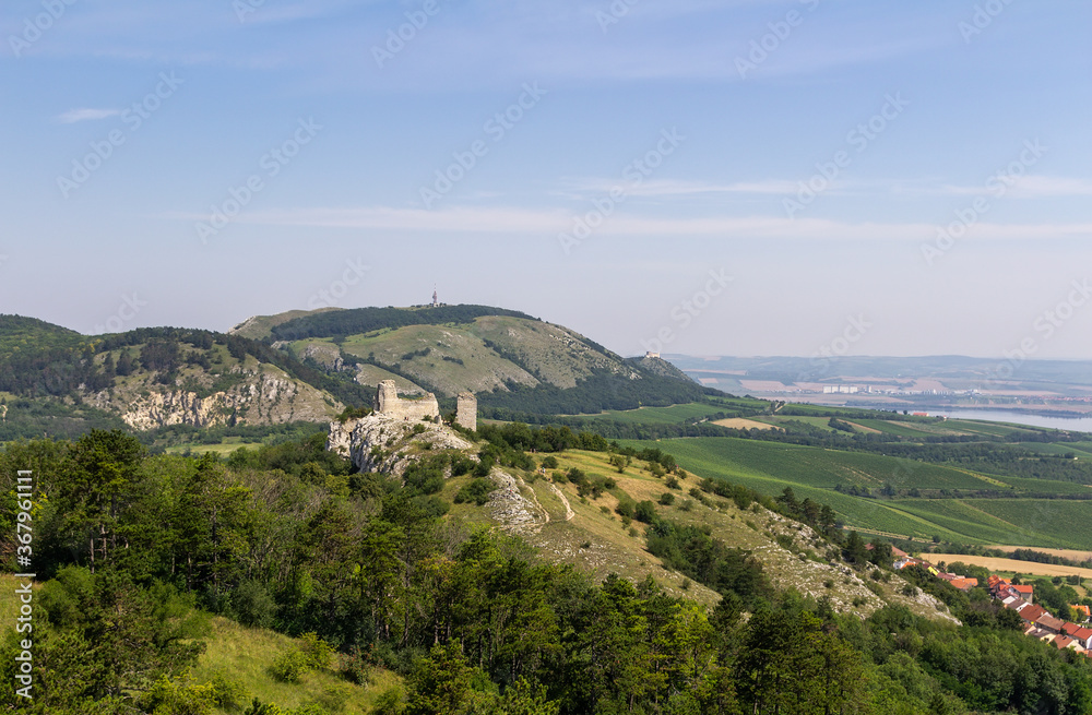 Sirotci and divci castle from lookout. Ruin of gothic castle in south moravia landscape, Palava Czech republic