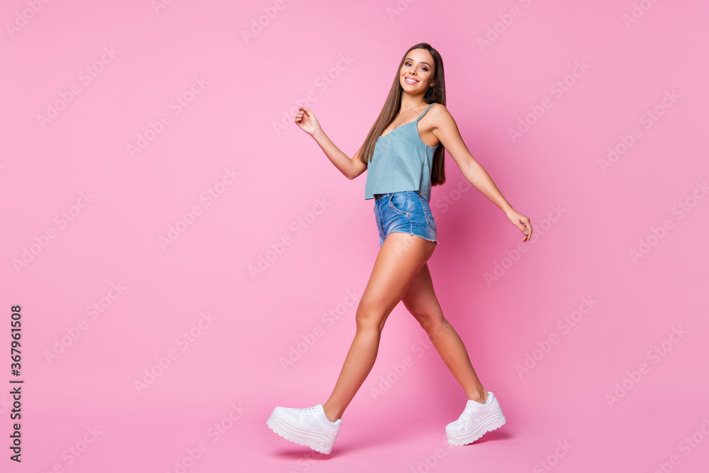 Full length body size view of her she nice-looking attractive lovely pretty winsome gorgeous cheerful cheery content brown-haired girl strolling isolated over pink pastel color background
