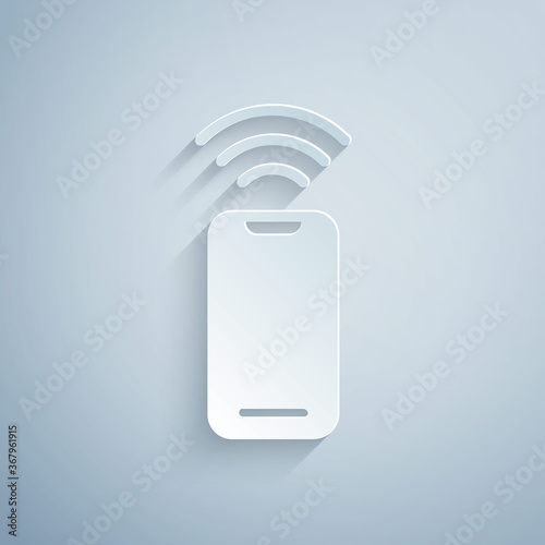 Paper cut Wireless smartphone icon isolated on grey background. Paper art style. Vector.