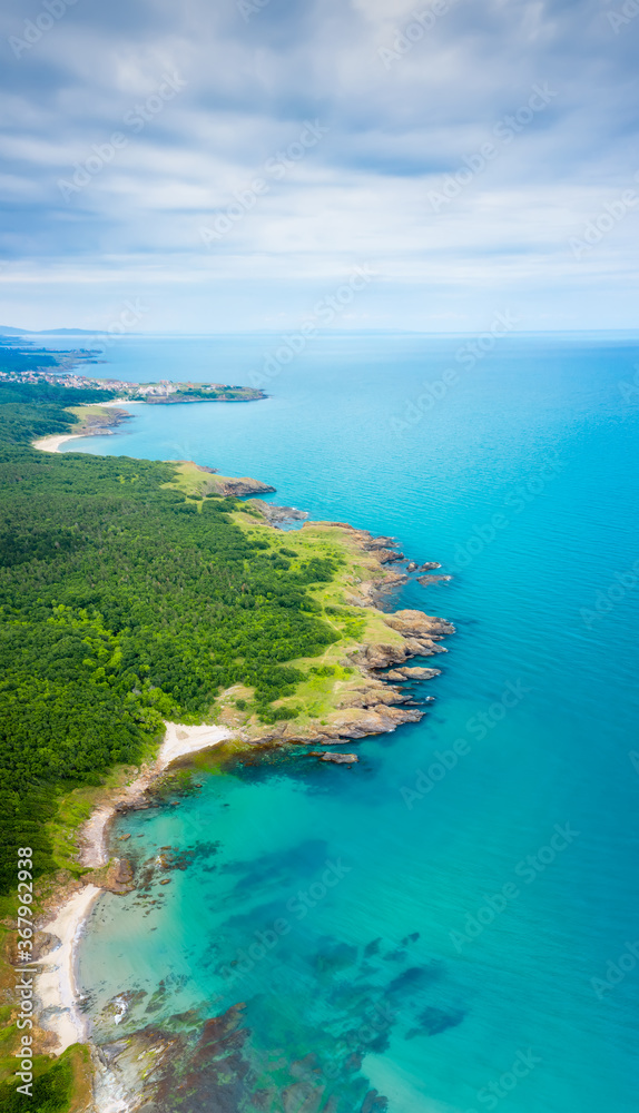 Aerial panoramic view of the wild beaches, surrounded by rocks and green dense forests on the southern Black Sea coast, Bulgaria. - obrazy, fototapety, plakaty 