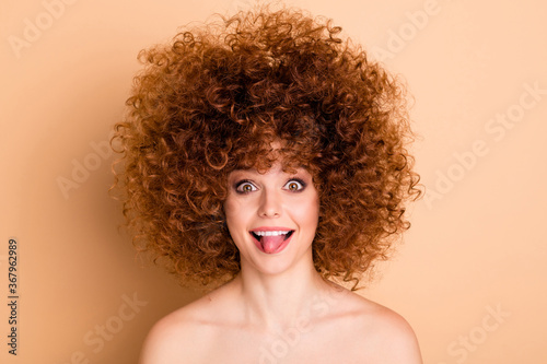 Close up photo beautiful foxy she her wear no clothes nude lady curls fashion procedure stylist perms roller curlers salon pretty tongue out mouth teasing careless isolated beige pastel background