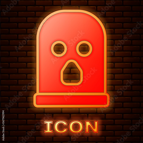 Glowing neon Balaclava icon isolated on brick wall background. A piece of clothing for winter sports or a mask for a criminal or a thief. Vector.