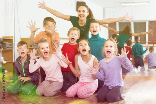 Active emotional children posing at dance class