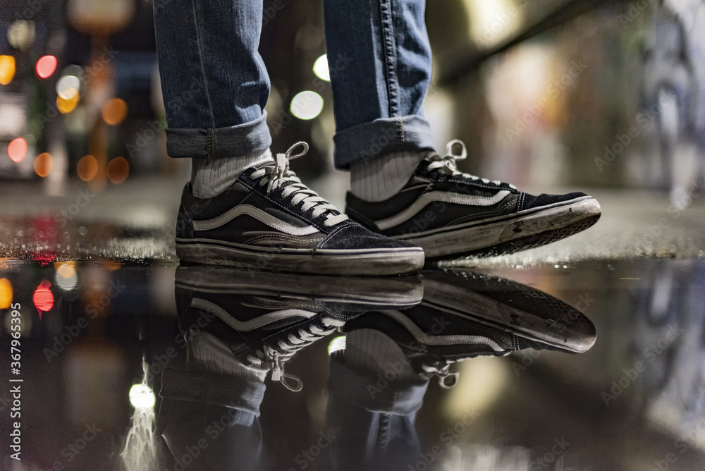 wearing Vans Old Skool shoes in the street Stock Photo | Adobe Stock