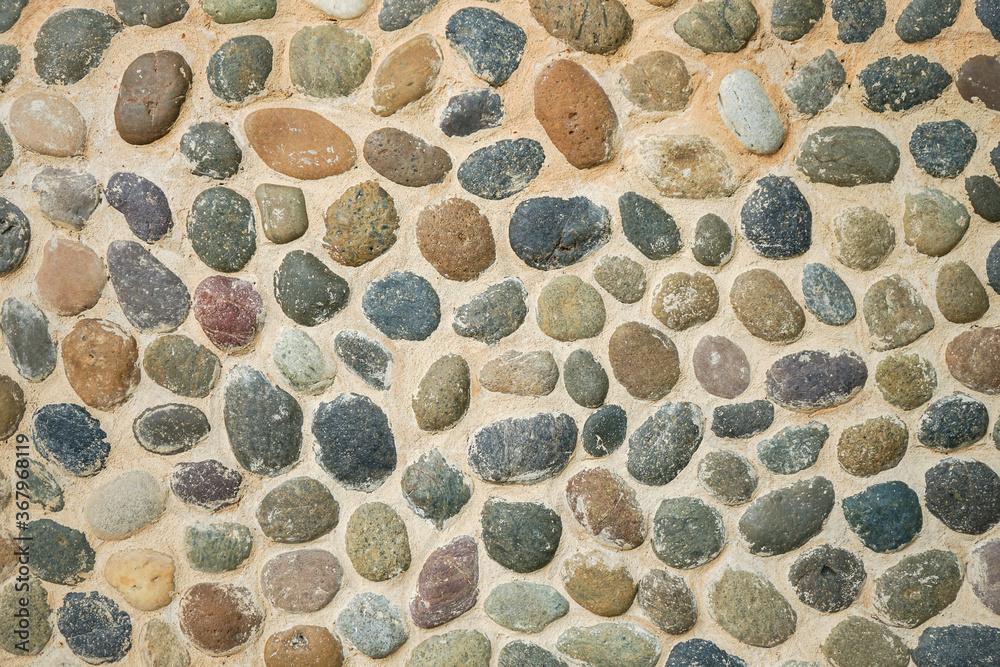 Pebbles stone wall or floor background