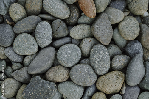 Pebbles stone or river stone background with vintage filter 