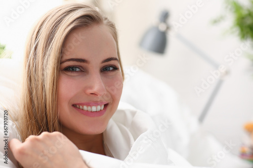 Young beautiful woman waking up in the morning concept