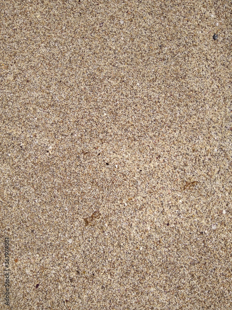 The sand structure on the Mediterranean coast in summer close up. The sand structure on the Mediterranean coast in summer close up.