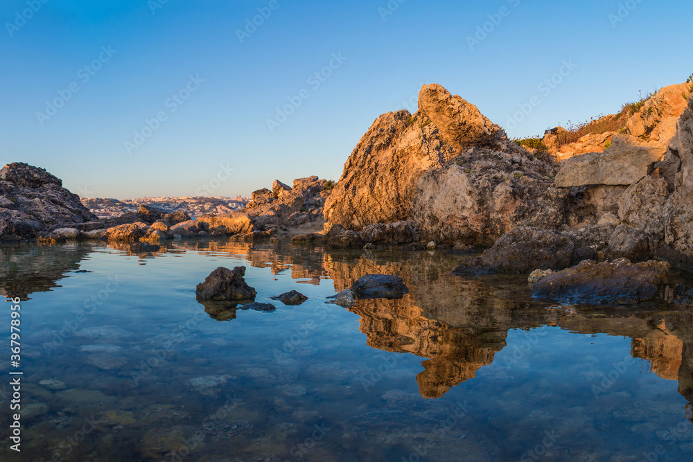 Reflection of the Maltese Landscape at Sunrise 
