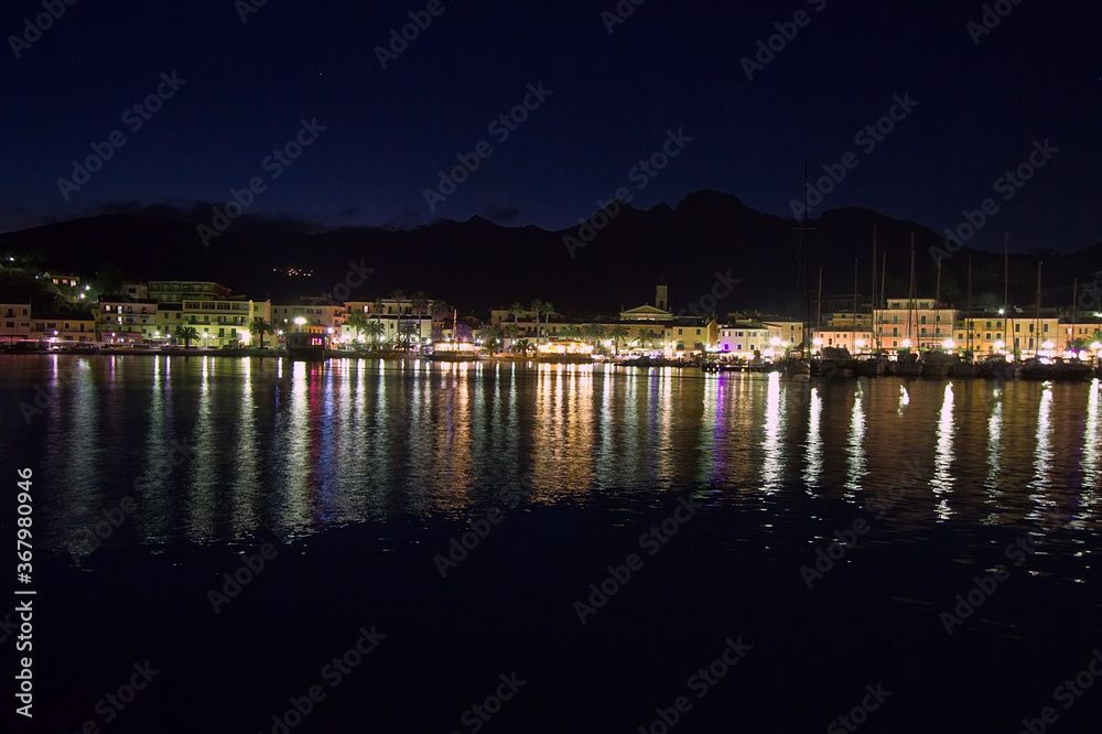 night landscape of coastline with reflections