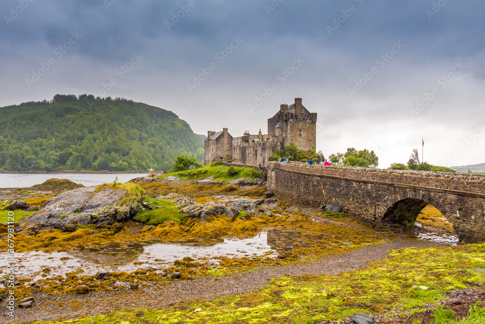 Stormy evening clouds over Eilean Donan Castle in the Scottish Highlands