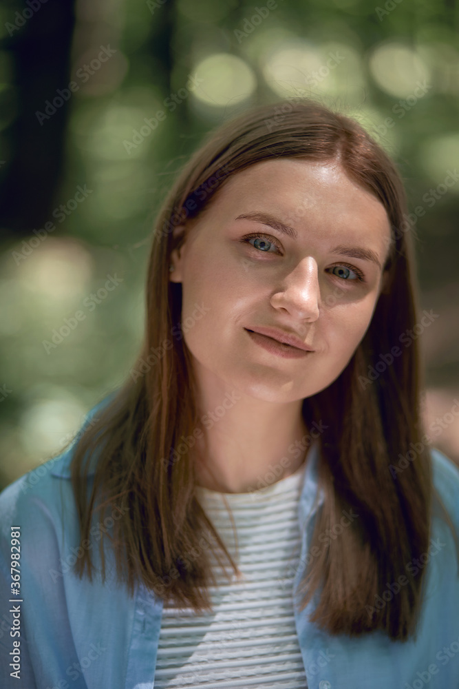 Vertical photo. Portrait of a young beautiful girl with clean skin. Vertical photo. Portrait of a young beautiful girl with clean skin.