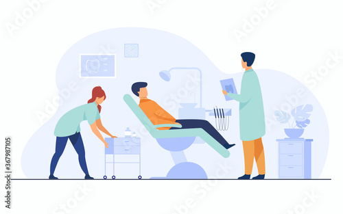 Dental clinic concept. Patient visiting dentist office, sitting in chair while doctor examining him with nurse assistance, holding report and discussing treatment. Flat cartoon characters