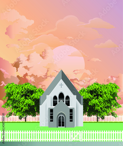 Rural Christian parish church building with white picket fence and gate set against a stunning dawn or dusk sky