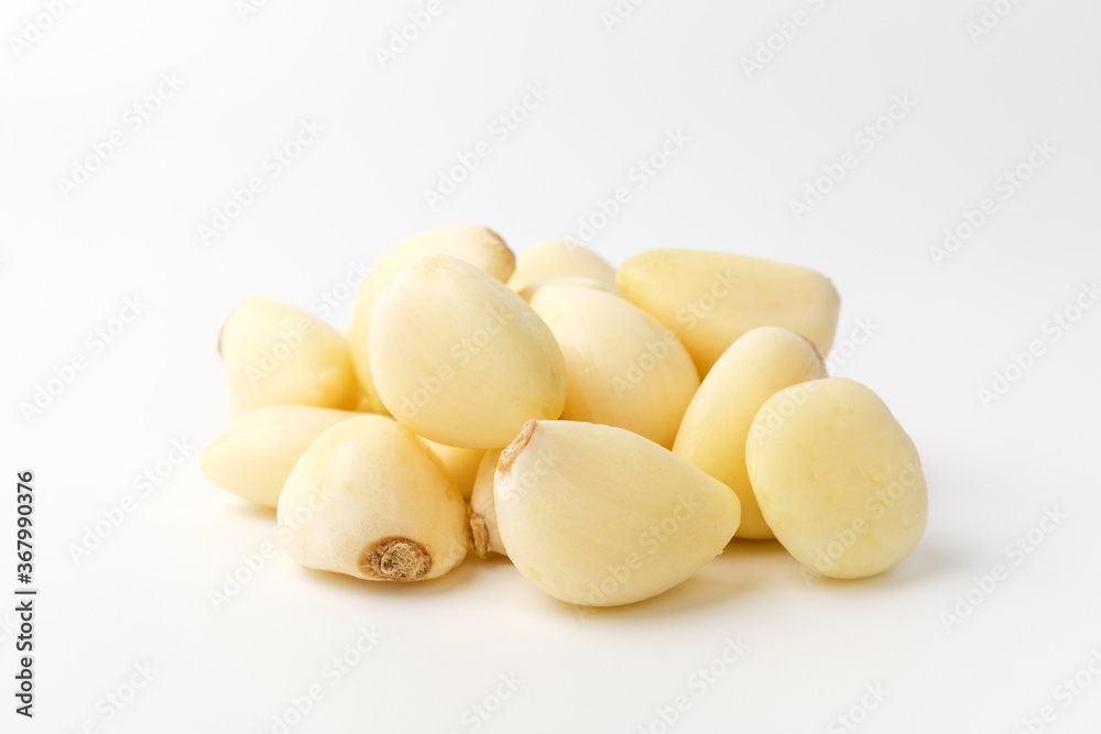Manicured garlic on white background