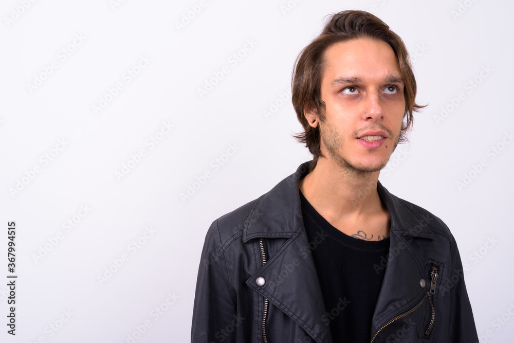 Fototapeta premium Portrait of happy young handsome rebellious man