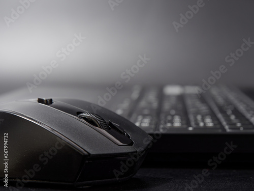 black modern computer mouse on dark background