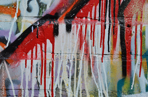 Paint flows down the wall Multi colored brick wall photo