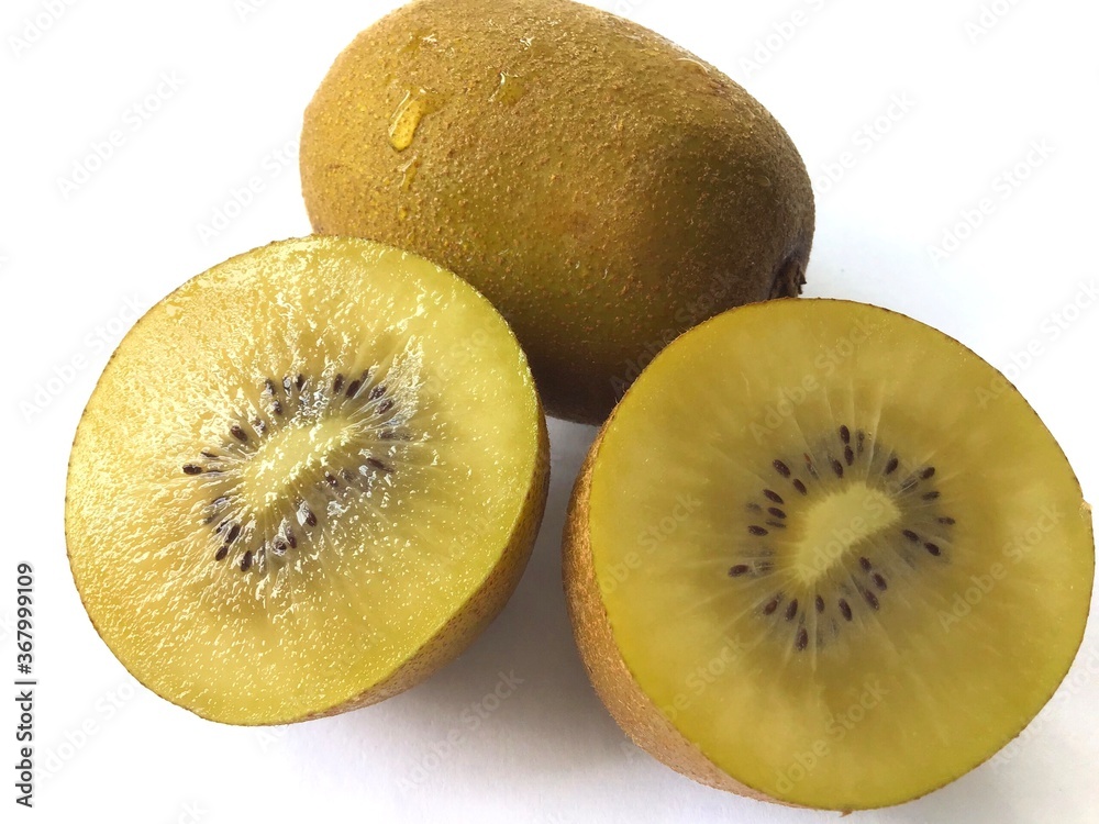 composition of fresh yellow kiwi fruits isolated on a white background