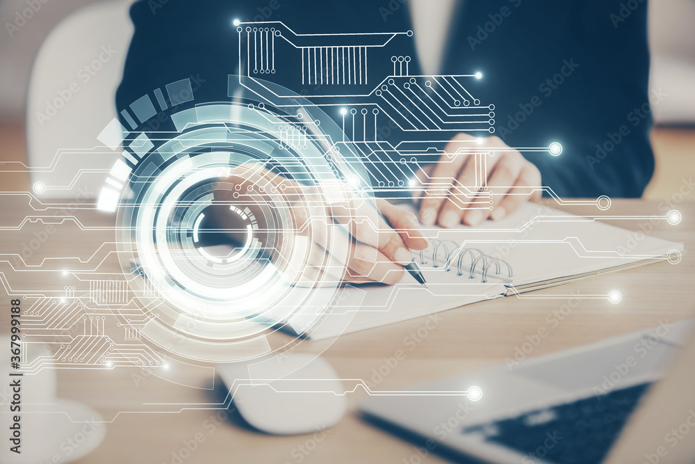 Double exposure of writing hands on background with data solution hologram on front. Technology concept. Close up Double exposure of writing hands on background with data solution hologram on front. Technology concept. Close up