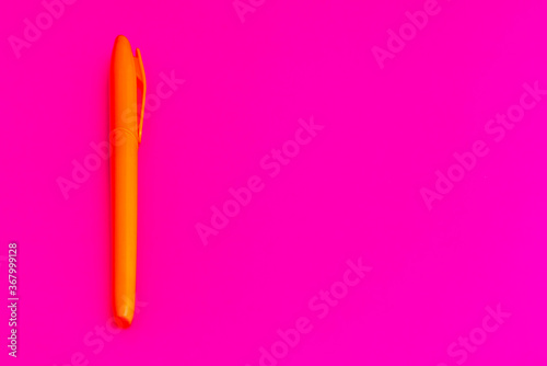 Magenta colored highlighters at magenta background with copy space