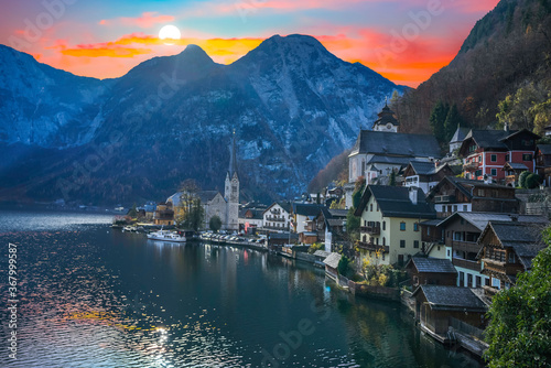 Hallstatt village and lake with sun setting behind the mountain