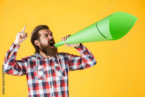 no privacy concept. Promotion and information expansion to masses. mass media concept. make voice louder. man shout in megaphone. man with paper loudspeaker. freedom of speech. ads for everyone photo