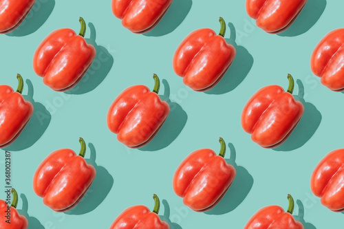 Pattern with sweet pepper on turquoise background.