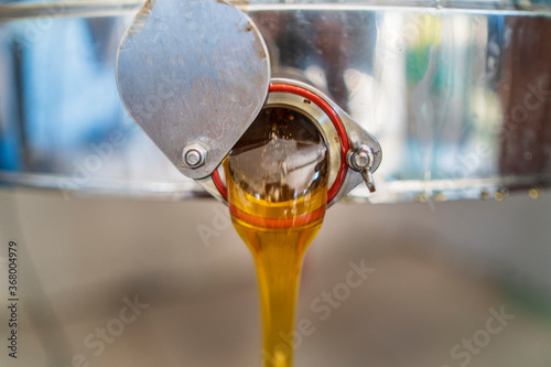 the honey leaving the deposit once filtered