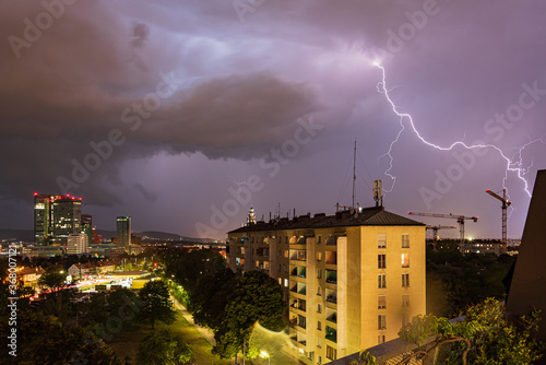 Photography Violent summer thunderstorm with enormous lightning over the Wienerberg City in