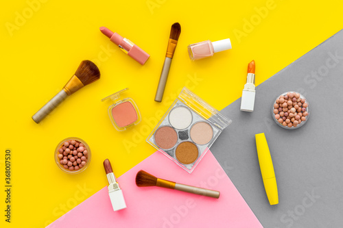 Flat lay of decorative cosmetics on color background. Above view