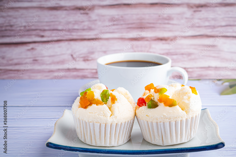 Thai steamed cupcakes topped with dry fruit on plate Thai steamed cupcakes topped with dry fruit on plate